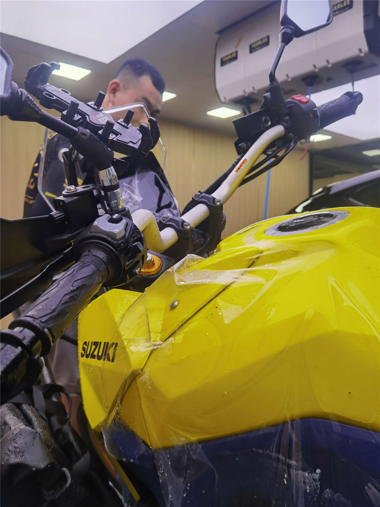 Suzuki motorcycle windshield and front cowl after PCU PPF installation completed - clarity and optical transparency demonstration