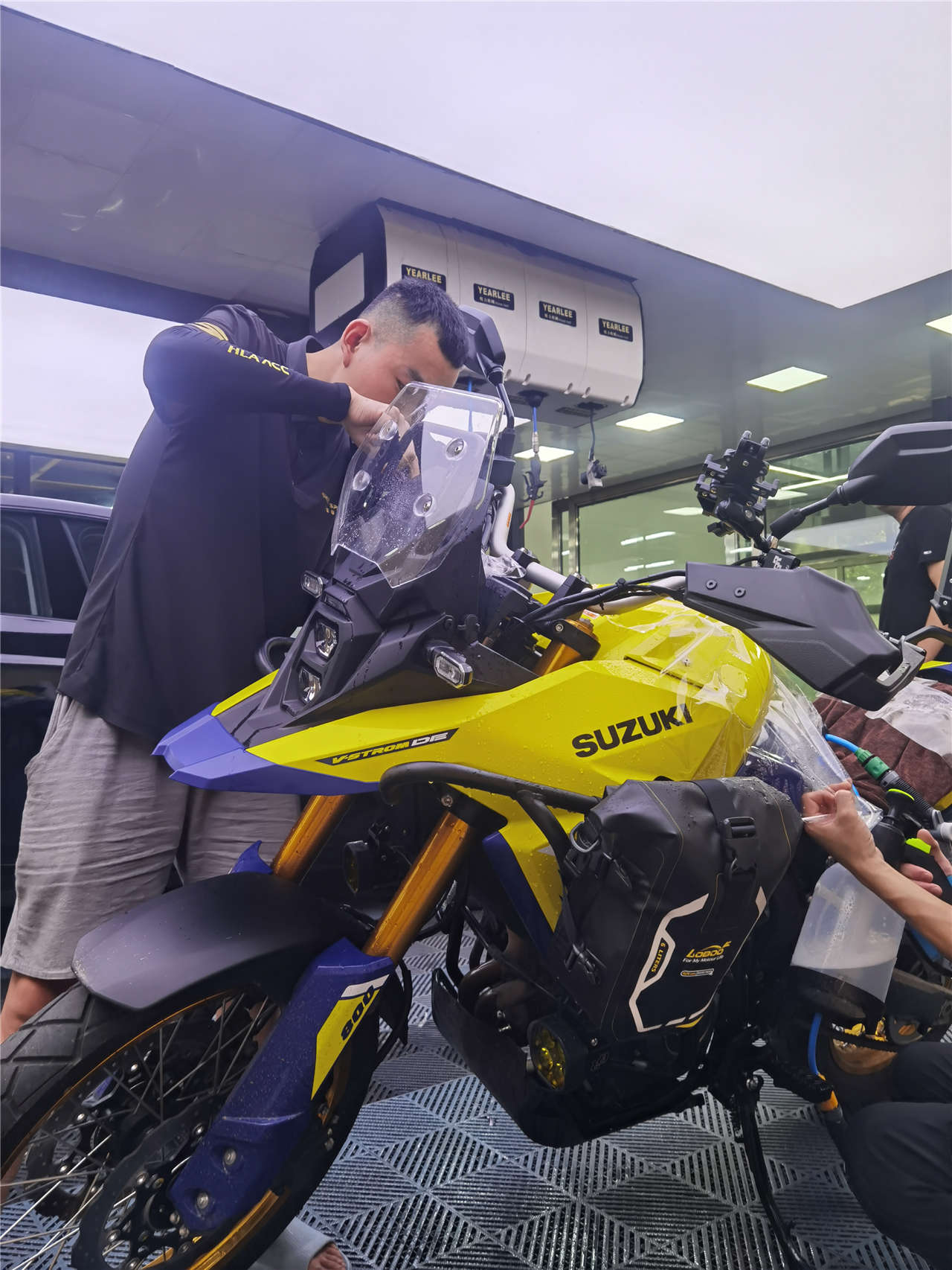 SHIELD SPIRIT branded installation bay - Suzuki motorcycle undergoing full PCU PPF wrap at direct store location in China