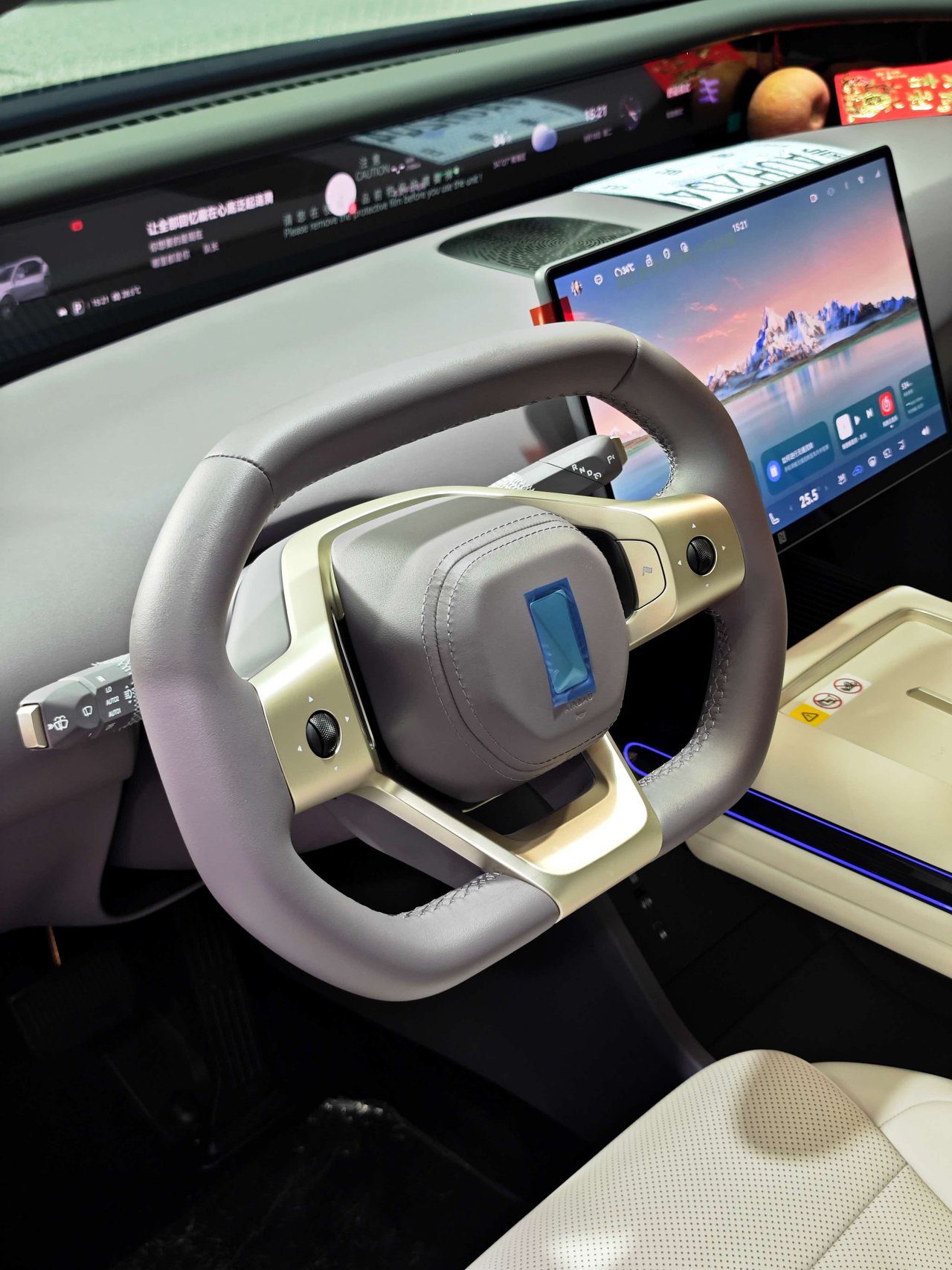 Vehicle interior showing steering wheel and dashboard during PPF installation process