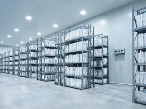 Vertically stored clear PPF film rolls in a climate-controlled warehouse representing safe storage